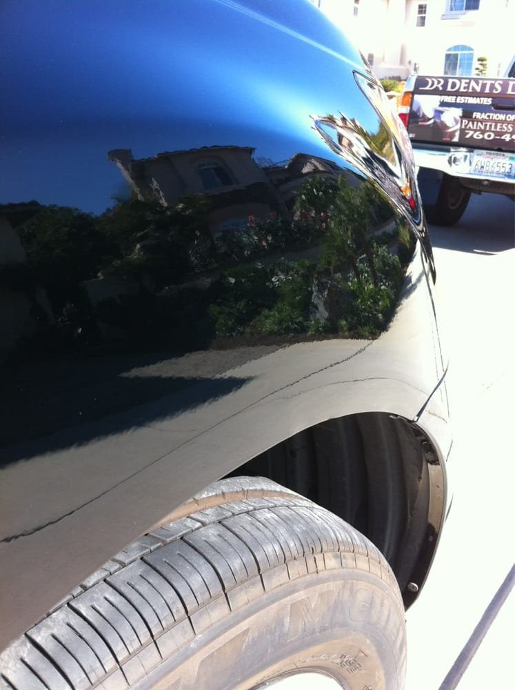 Real repaired black fender with a straight reflection