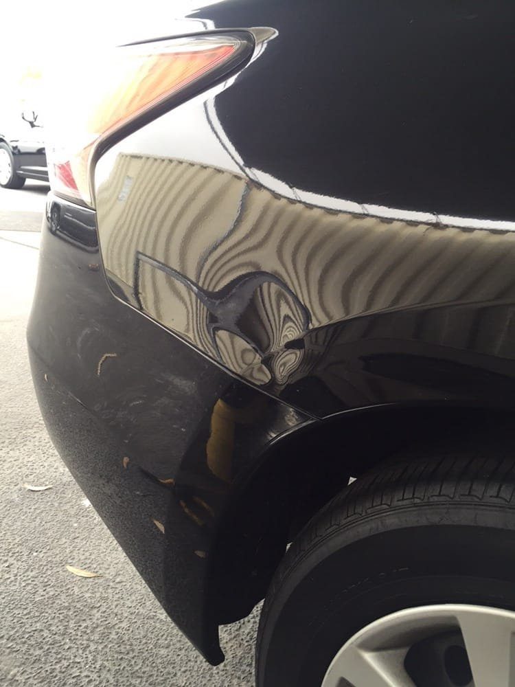 Panel before paintless dent repair