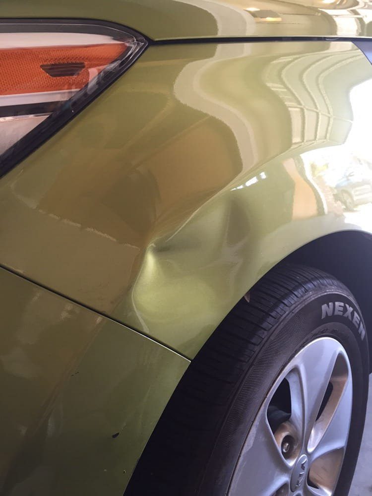 Panel before paintless dent repair