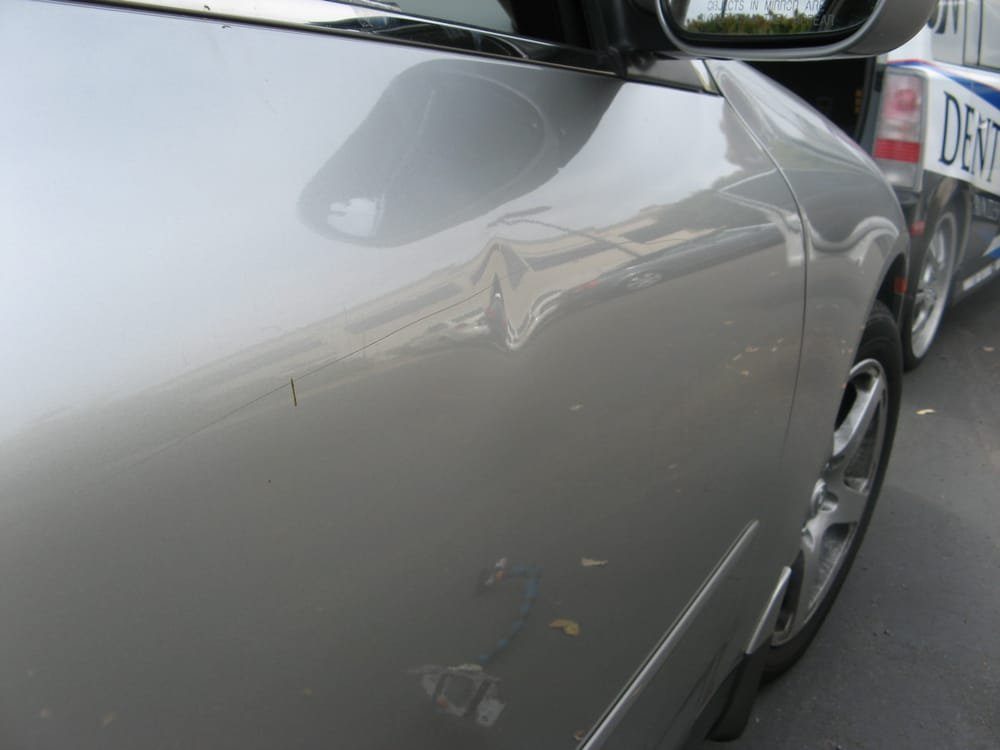 Panel before paintless dent repair