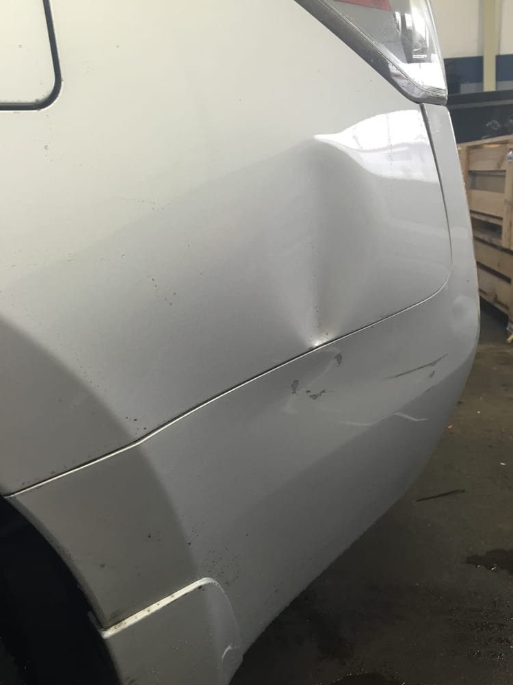 Panel before paintless dent repair