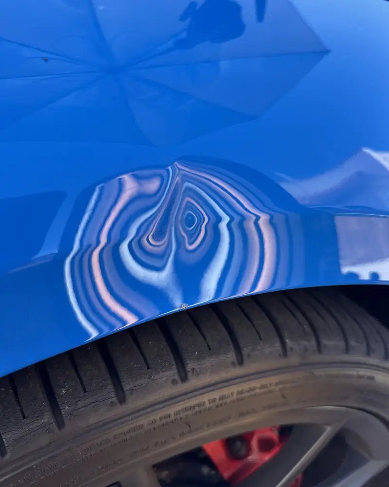 Panel before paintless dent repair